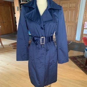 bebe Navy Sateen trench coat with classic styling.  Size Large